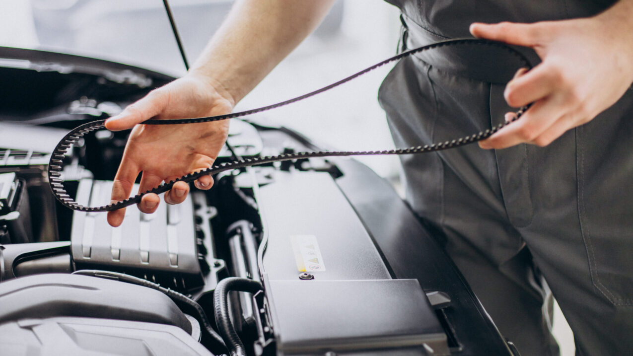 Repair man making car service